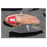 Two Quest skateboards and one Wham-O boogie