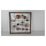 Metal wall sculpture in wood frame, 22x22