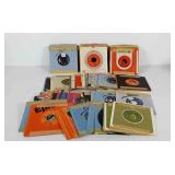 Large group of 45 rpm records in sleeves,