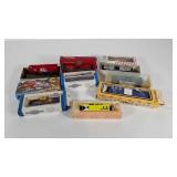 Toy train cars, eight with boxes, they may need