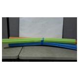 Bundle of pool noodles. Four in assorted colors.