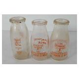 Three Pensupreme milk bottles, 5.5"-6"