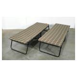 Two Colman 68" cots with pads