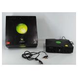 Xbox game system with cables, powers on, seller