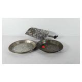 Two pie tins and one flour scoop