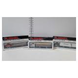 Three Lionel tractor and trailers, steel, grain,