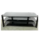 Three tiered tv stand in black tubular metal and