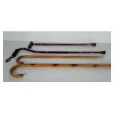 4 walking canes. The wooden canes measure 38" &