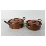 Hammered copper and brass pots with lids, handles