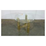 Glass topped accent table with gold tone legs,