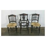 Three painted chairs, two with rush seats and one