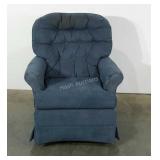 Upholstered swivel rocker. Needs cleaning.