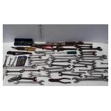Tools, mostly combination wrenches, also includes