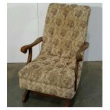 Upholstered rocking chair, fabric is worn as