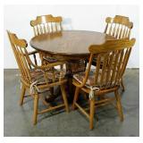 Pedestal dining table with two Captains and two