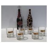 Glassware, two 11.5" tall decorated glass bottles