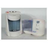 Two Holmes misters / humidifiers. Both power on.