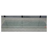 Two pieces of glass, probably cabinet shelves.