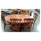 Pedestal 48" round table with six chairs and one