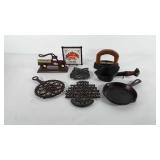Cast iron mixed group, includes trivets, nut