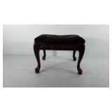 Foot stool with needlepoint top, legs show wear,