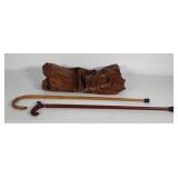 Surveyor leather jacket and two wooden canes with