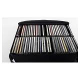 CD case full of CDs, includes Eric Clapton, Toby