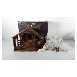 Lighted stable nativity scene with some