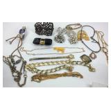 Jewelry, wrist arches, and a travel clock