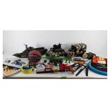 Group of toys, military vehicles, light saber,