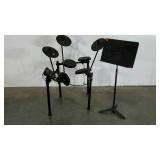 Alesis electronic drum kit and a music stand,