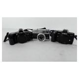 Camera group, three Minolta cameras, includes
