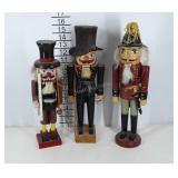 Three wooden nutcrackers, one marked Silvestri,