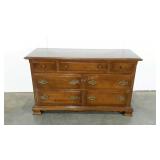 Ethan Allen seven drawer dresser on wheels.