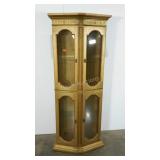 Lighted curio cabinet with glass doors and