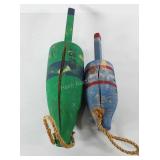 Wooden buoys, both have been painted and have