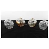 Four glass pig coin banks, some have a few cents
