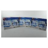 Three lighted waterfalls in boxes, all appear to