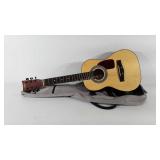 First Act acoustic guitar with soft shell case,