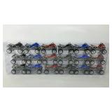 Three sleeves of 6 different mini 4 wheeler toys