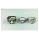 Three Sterling silver CZ rings sizes 10, 7, and