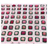 Crocheted rose granny square throw with 3D pink