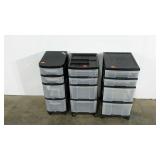 Three plastic storage towers, all on casters