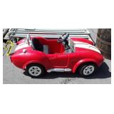 Cobra power wheels car, has charger and very w