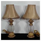 Pair of vanity lamps with bead fringed shades.