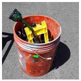 Five gallon buckets with sprinklers and hose