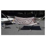 Rope hammock with cushion on stand, ready to use