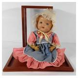 Early composition doll with display case, marked