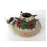 Lighted Christmas tree stand with poinsettia