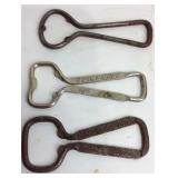 Three bottle openers two are Coca-Cola